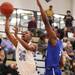 Skyline's Marquis Wesley goes up for a layup over DeMarqus Washington as Skyline took on Ypsilanti Lincoln at Skyline High School Thursday December 15, 2011. Skyline won the game 54-51.  Jeff Sainlar I AnnArbor.com