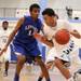 Skyline's Theron Wilson drives past Christopher Williams as Skyline took on Ypsilanti Lincoln at Skyline High School Thursday December 15, 2011. Skyline won the game 54-51.  Jeff Sainlar I AnnArbor.com