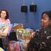 Volunteer Cora Evans,left, helps pick out presents for a family as the Salvation Army of Washtenaw County will put toys under the tree for local families in need at its annual Christmas Toy Shop. Families who signed up for Christmas assistance picked out toys for children, as well as a gift card to Meijers. An estimated over 550 families would be stopping in at the Salvation Army on Arbana Dr.  Friday December 16, 2011. Volunteers from all around Washtenaw County came to help the cause. Jeff Sainlar I AnnArbor.com