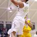 Mike Lewis takes the ball to the hoop as Ann Arbor Huron took on Ypsilanti  at Huron High School Friday December 16, 2011. Ypsilanti won the game 66-57. Jeff Sainlar I AnnArbor.com