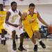 Ypsilanti's Caleb Baldwin drives past Demetrius Sims' defense as Ann Arbor Huron took on Ypsilanti  at Huron High School Friday December 16, 2011. Ypsilanti won the game 66-57. Jeff Sainlar I AnnArbor.com