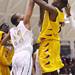 Lavonte Davis tries to force the shot up as Ann Arbor Huron took on Ypsilanti  at Huron High School Friday December 16, 2011. Ypsilanti won the game 66-57. Jeff Sainlar I AnnArbor.com