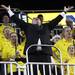 The Michigan alumni band director tries to excite the crowd as Michigan women's basketball team took on Indiana St Saturday December 17, 2011. Michigan won the game 72-44. Jeff Sainlar I AnnArbor.com