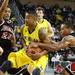 Michigan's Trey Burke tries to hold on to Dyricus Simms-Edwards' strip attempt as the Michigan men's basketball team took on Bradley at Crisler Arena Thursday December 22, 2011. Michigan won the game 77-66. Jeff Sainlar I AnnArbor.com