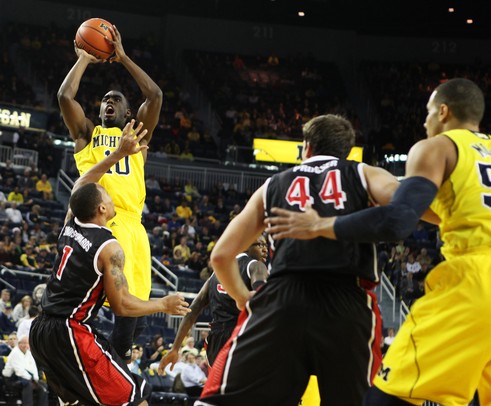 Tim Hardaway Jr. takes a shot over Dyricus Simms-Edwards as the Michigan men's basketball team took on Bradley at Crisler Arena Thursday December 22, 2011. Michigan won the game 77-66. Jeff Sainlar I AnnArbor.com