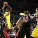 Tim Hardaway Jr. takes a shot over Dyricus Simms-Edwards as the Michigan men's basketball team took on Bradley at Crisler Arena Thursday December 22, 2011. Michigan won the game 77-66. Jeff Sainlar I AnnArbor.com