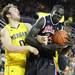 Zack Novak and Shayok Shayok battle for a rebound as the Michigan men's basketball team took on Bradley at Crisler Arena Thursday December 22, 2011. Michigan won the game 77-66. Jeff Sainlar I AnnArbor.com
