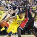 Trey Burke looks for room around Shayok Shayok as the Michigan men's basketball team took on Bradley at Crisler Arena Thursday December 22, 2011. Michigan won the game 77-66. Jeff Sainlar I AnnArbor.com